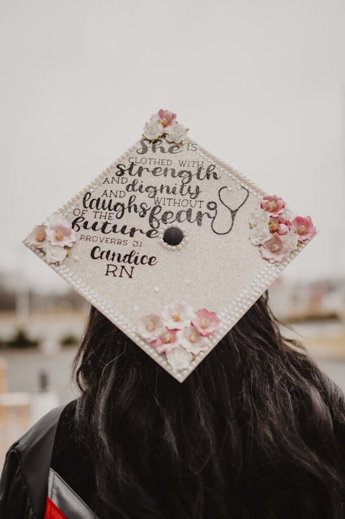 Decorated graduation cap with an inspiring quote and floral design.