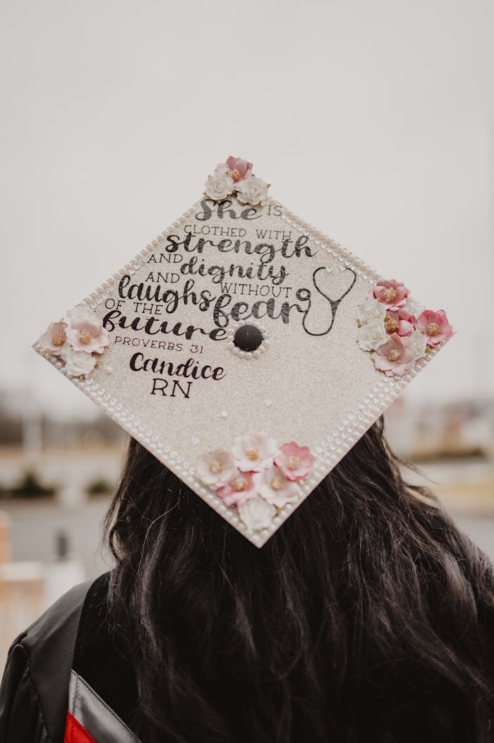 Decorated graduation cap with an inspiring quote and floral design.